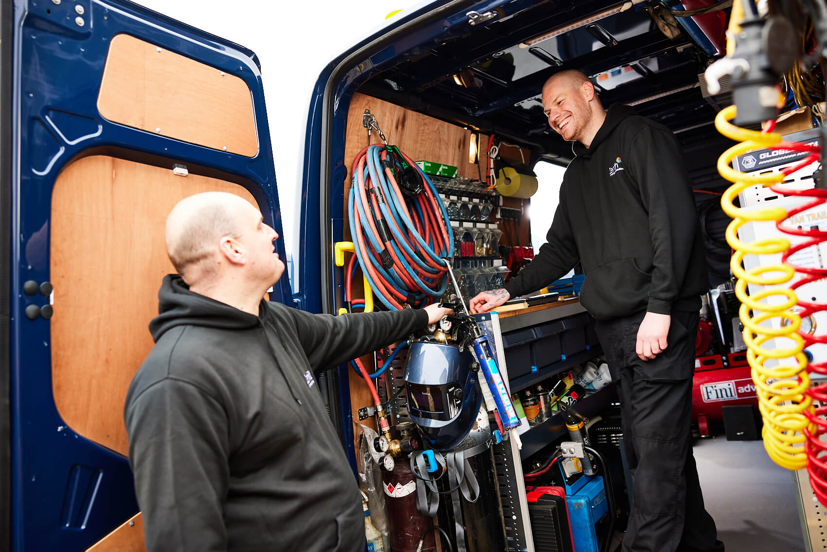 Image of mobile service technicians working in their unit